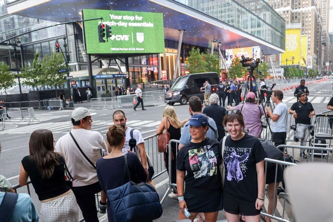 Spectators wear Taylor Swift shirts outside of Madison Square Garden in New York on July 3.