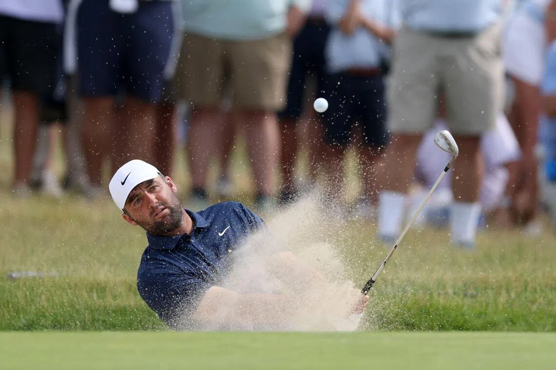 Scottie Scheffler of the United States plays a shot from the bunker on the 13th hole during the second round of the 126th U.S. OPEN at Shinnecock Hills Golf Club.