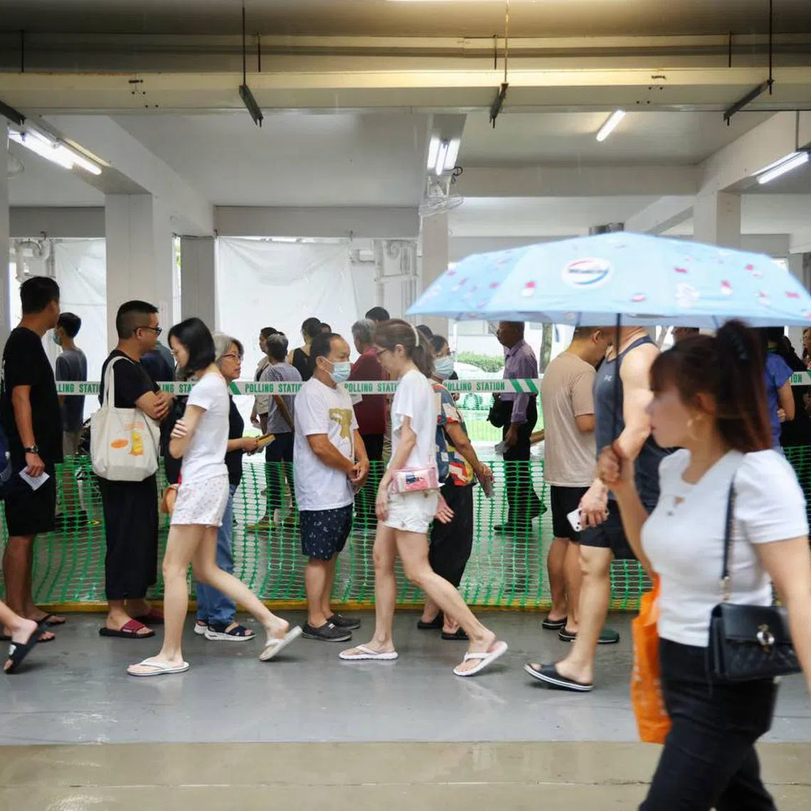 Residents casting their vote at the void deck of 608 Clementi West Street 1 on May 3.