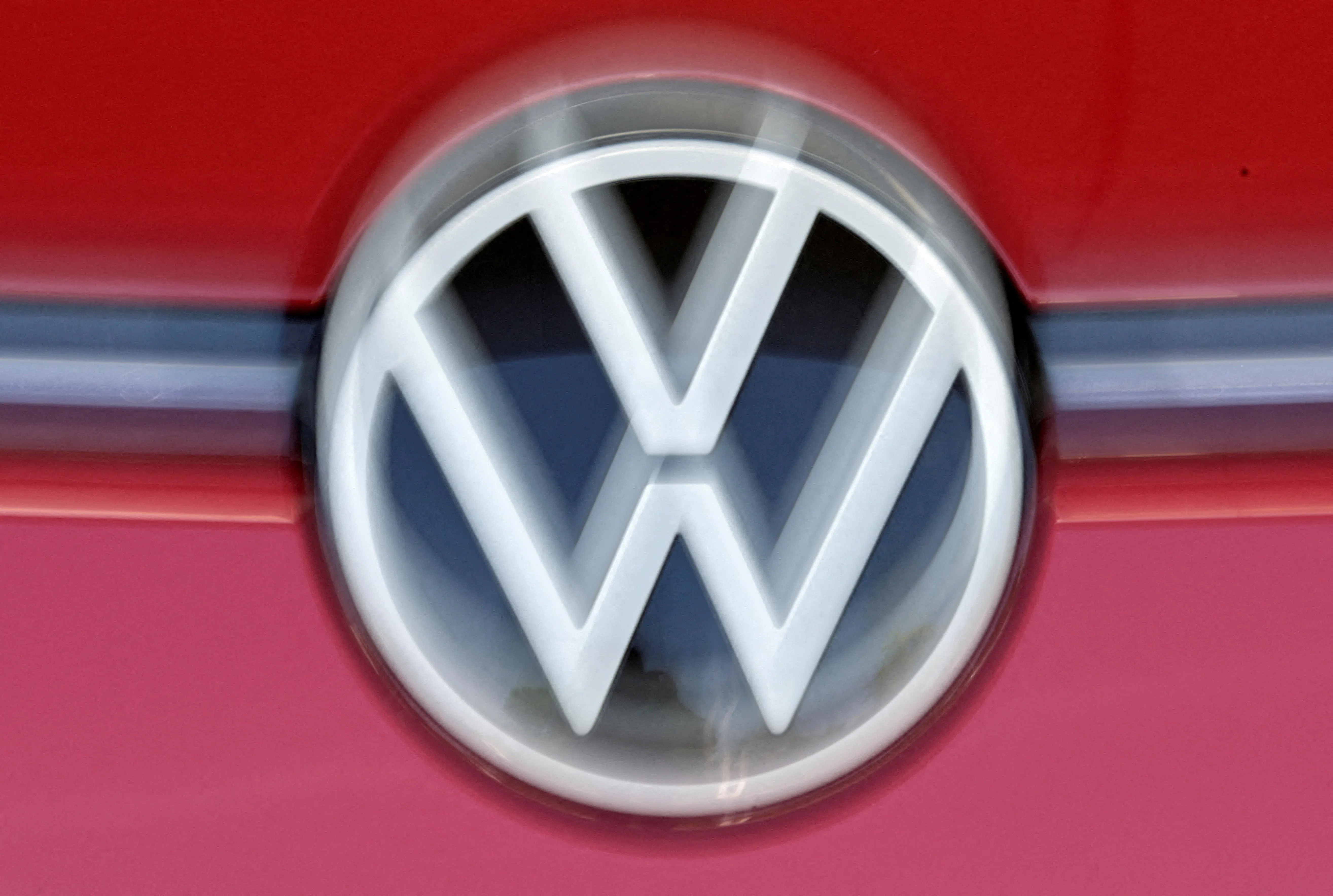 FILE PHOTO: The VW logo is seen in the final inspection line of German carmaker Volkswagen's electric ID. 3 car, during a media tour, in Dresden, Germany, May 14, 2025. REUTERS/Matthias Rietschel/File Photo