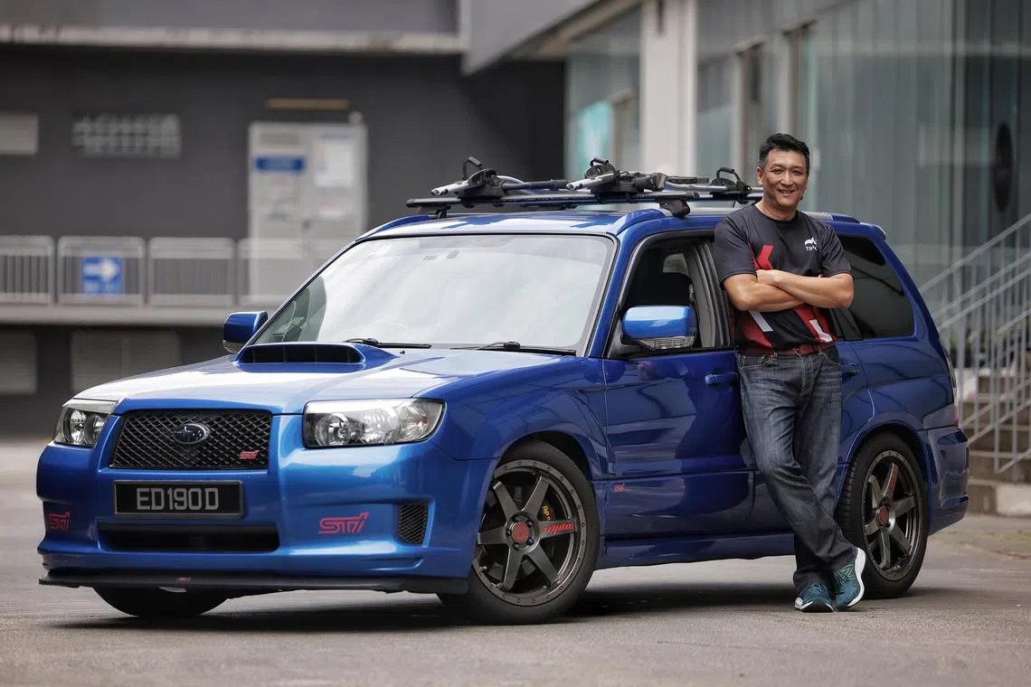 Businessman Derek Han and his 2007 Subaru Forester STI on July 17, 2024. For Me And My Car column.