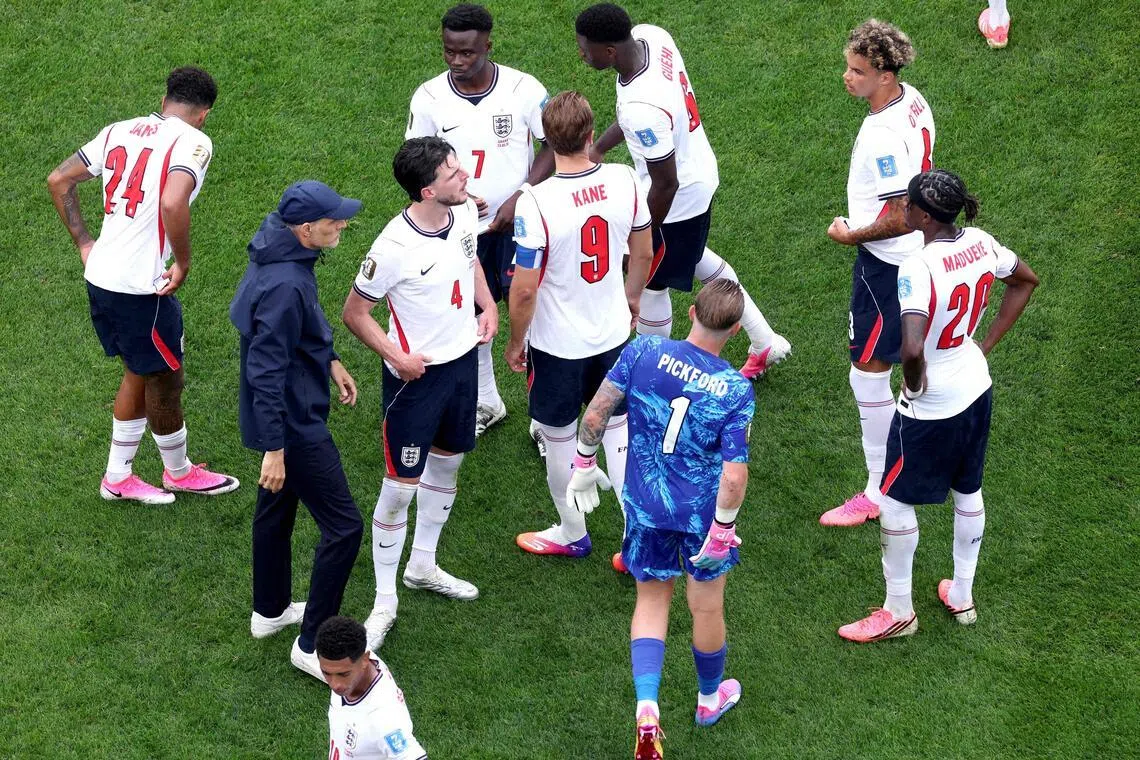England manager Thomas Tuchel speaking to his players during a hydration break at the World Cup match against Ghana at Boston Stadium on June 23.