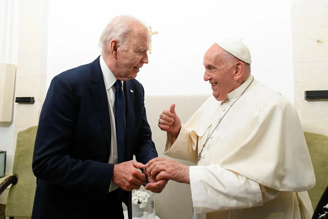 FILE PHOTO: Pope Francis and U.S. President Joe Biden meet as they attend the G7 summit, in Savelletri, Italy June 14, 2024. Vatican Media/­Handout via REUTERS/File Photo