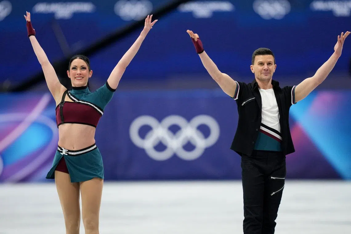 Feb 9, 2026; Milan, Italy; Charlene Guignard and Marco Fabbri of Italy react after skating during ice dancing at the Milano Cortina 2026 Olympic Winter Games at Milano Ice Skating Arena. Mandatory Credit: James Lang-Imagn Images