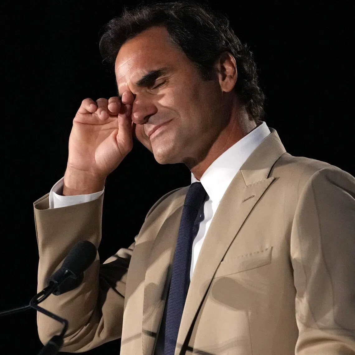 Roger Federer weeps during his speech in Newport, Rhode Island, when he was inducted into the International Tennis Hall of Fame on Aug 29.