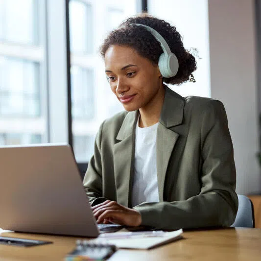 Headphones at work may boost productivity, but recent research shows they can leave a less positive impression on others.
