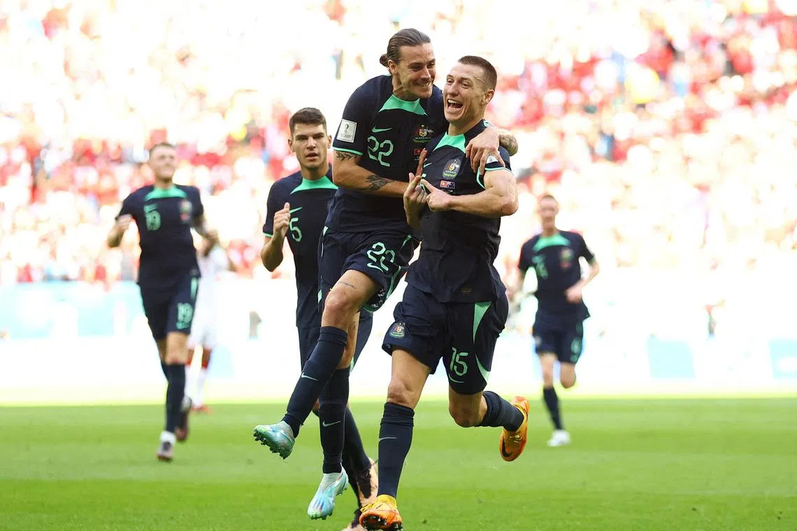 Australia's Mitchell Duke celebrates scoring in the 1-0 World Cup win over Tunisia with Jackson Irvine.  