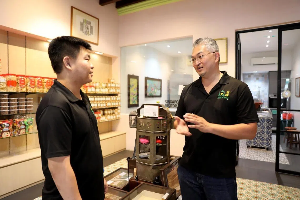 Homegrown business Kim Choo Kueh Chang’s third-generation owner Edmond Wong (right) has hired about 18 people with disabilities in part-time roles.