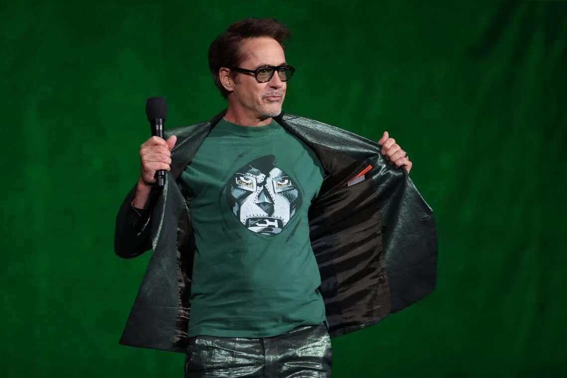 Robert Downey Jr. shows his Doctor Doom T-shirt as he promotes Avengers: Doomsday  at CinemaCon on April 16, in Las Vegas, Nevada.