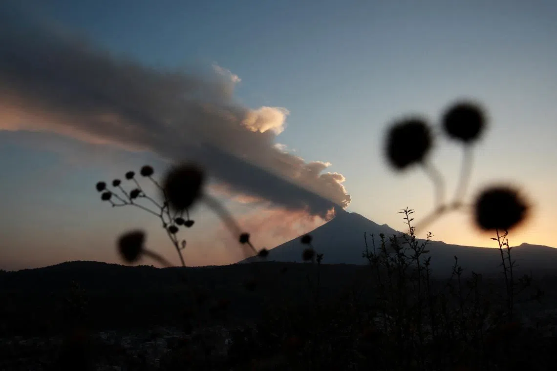 Popocatepetl volcano spews a column of ash and smoke as authorities declare a yellow alert after an increase in volcanic activity, as seen from Santiago Xalitzintla, in the state of Puebla, Mexico, February 22, 2024. REUTERS/Henry Romero/File Photo