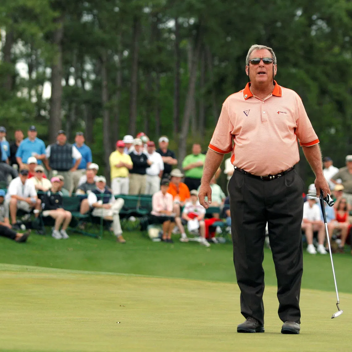 FILE PHOTO: Former champion Fuzzy Zoeller shouts to the gallery on the 18th green before stroking his final putt in his final competitive round during second round play at the 2009 Masters golf tournament at the Augusta National Golf Club in Augusta, Georgia, April 10, 2009. REUTERS/Hans Deryk /File Photo