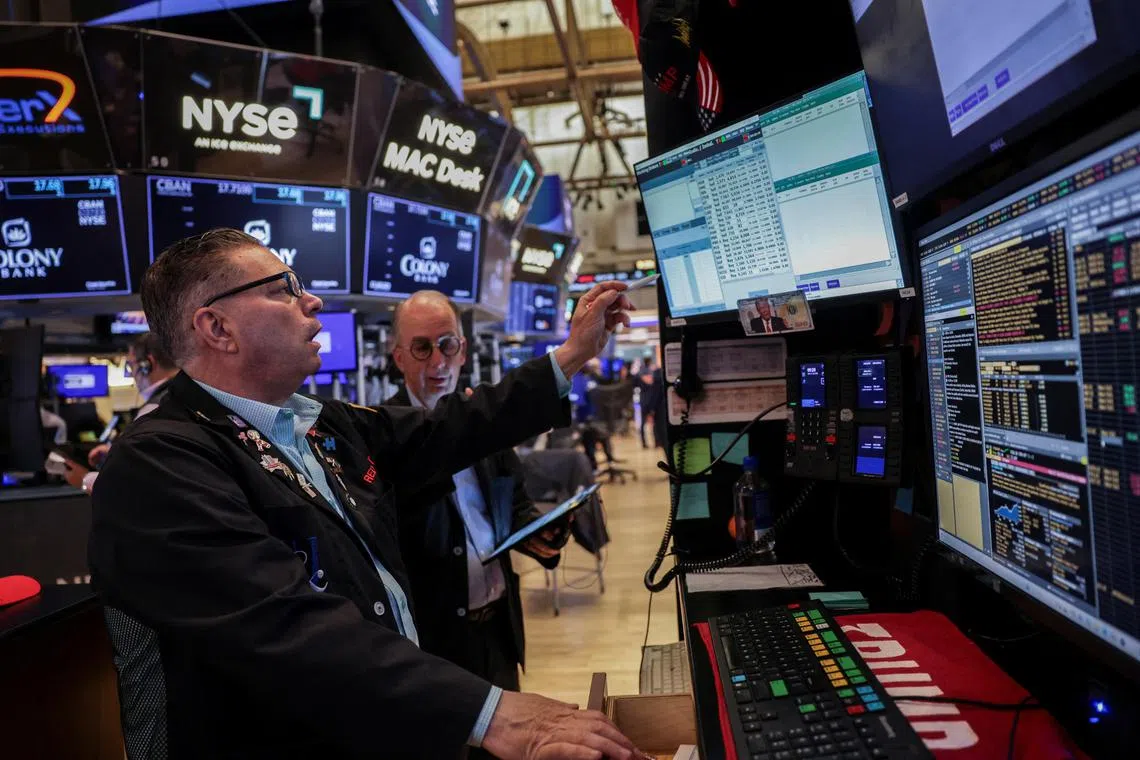 Traders working on the floor of the New York Stock Exchange, in New York City, on July 15.