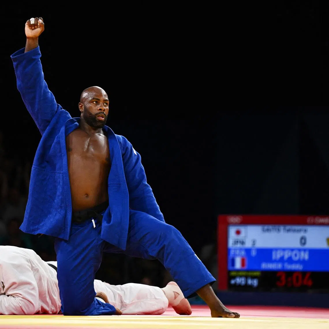 Paris 2024 Olympics - Judo - Mixed Team Final - Champ de Mars Arena, Paris, France - August 03, 2024. Teddy Riner of France reacts after winning his match against Tatsuru Saito of Japan. REUTERS/Arlette Bashizi