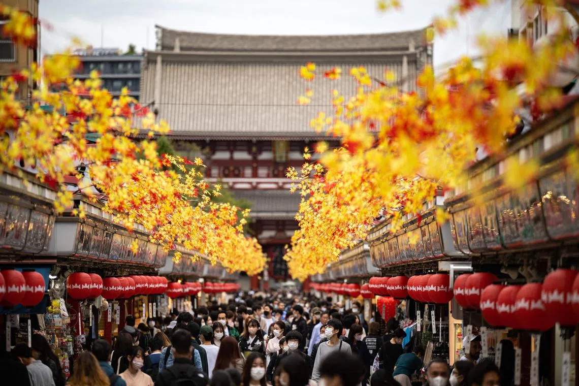 People visit Sensoji Temple, a popular tourist location in Tokyo.