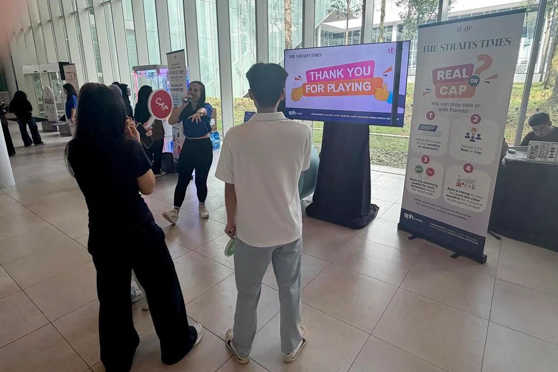 Students testing themselves on how well they know they news, at a recent ST outreach roadshow at Republic Polytechnic.
