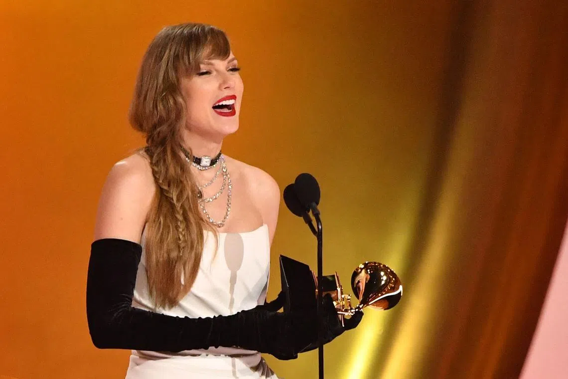 Taylor Swift made history winning an unprecedented fourth Album of the Year award with her pop record Midnights (2022).