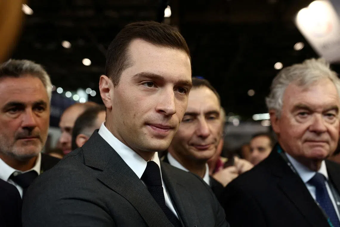 Jordan Bardella, President of the French far-right National Rally (Rassemblement National - RN) party, visits the Eurosatory international land and air defence and security trade fair on a campaign trip for the upcoming French parliamentary elections, in Villepinte near Paris, France, June 19, 2024. REUTERS/Stephanie Lecocq