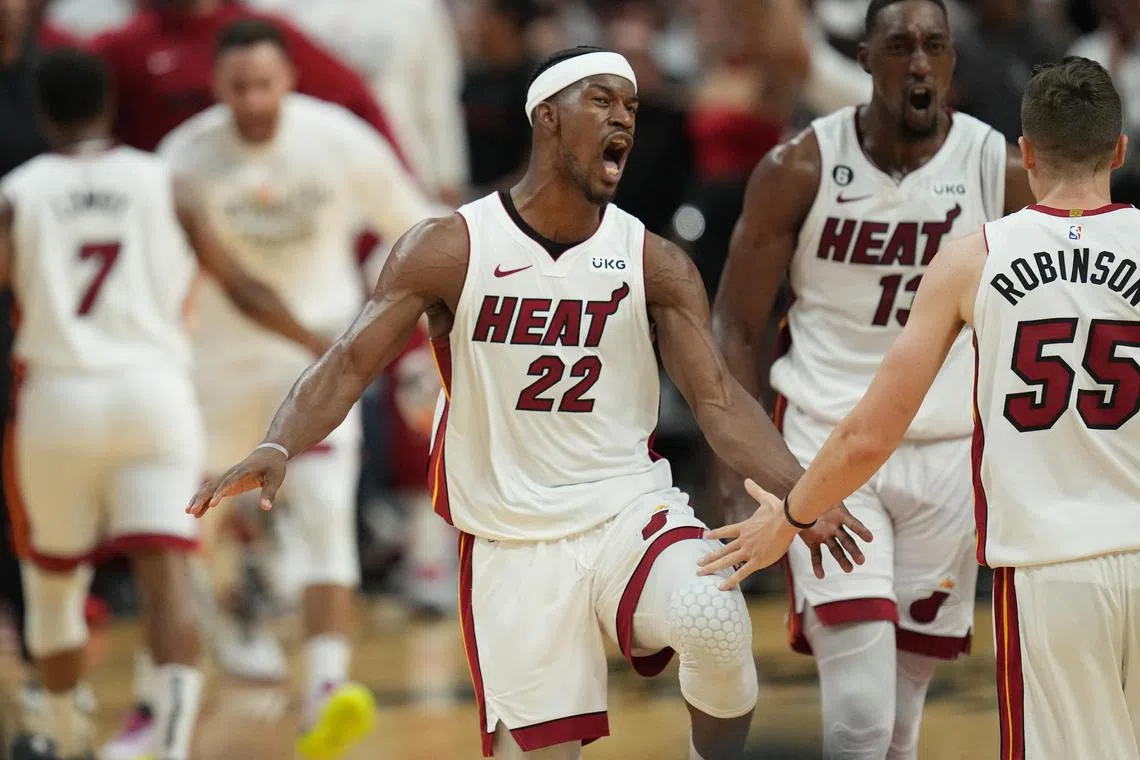 Miami Heat forward Jimmy Butler celebrates after making a shot against the Milwaukee Bucks in the fourth quarter during Game 4 of the NBA play-offs.