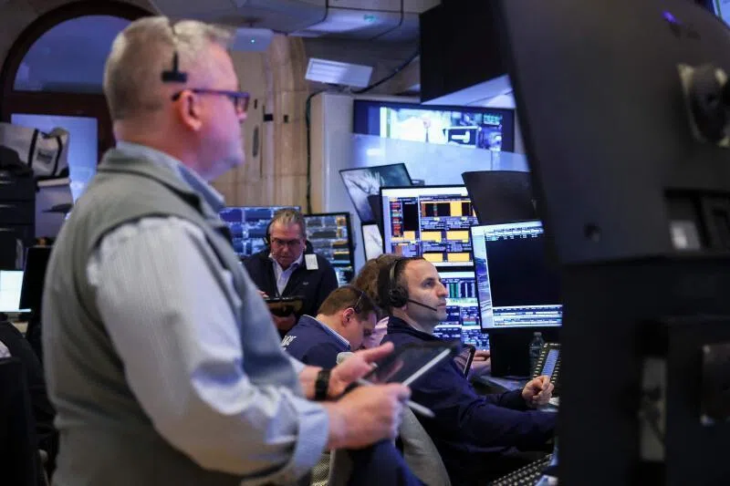 Traders work on the floor of the New York Stock Exchange during the opening bell in New York, on May 11.