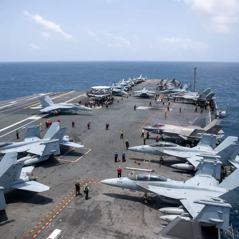 U.S. Navy sailors work on the flight deck of the aircraft carrier USS George Washington as it transits the Arabian Sea to support U.S. military operations in the war with Iran August 20, 2026. U.S. Navy/Handout via REUTERS