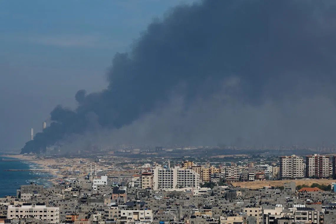 Smoke rises from the Israeli side after Palestinian Hamas gunmen infiltrated areas of southern Israel, as seen from Gaza, October 7, 2023. REUTERS/Mohammed Salem/File Photo
