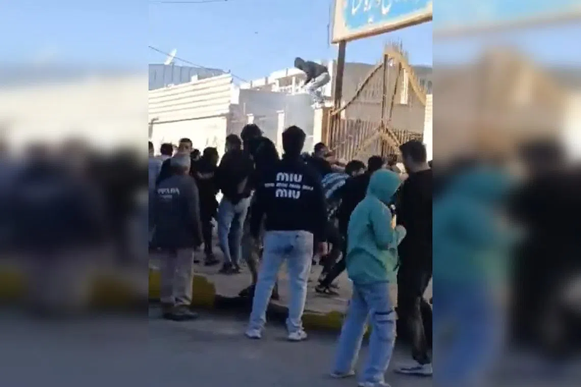 A screenshot from an online video said to show protesters storming the governor’s office in Fasa, in south-central Iran.