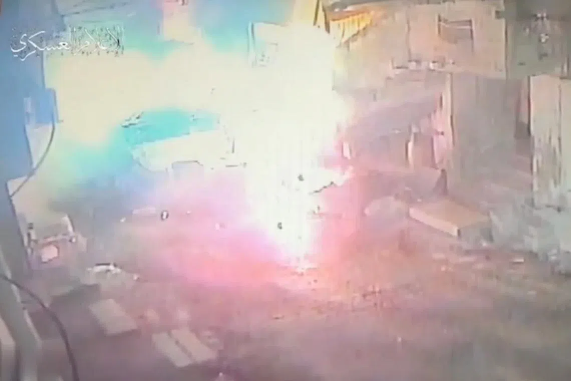 A view shows an explosion, which the Al-Qassam Brigades says was following the detonation of a military bulldozer, in this screengrab obtained from a handout video in a location given as Tulkarm, Israeli-occupied West Bank,  released on December 24, 2024. Al-Qassam Brigades -Tulkarm Battalion/Handout via REUTERS