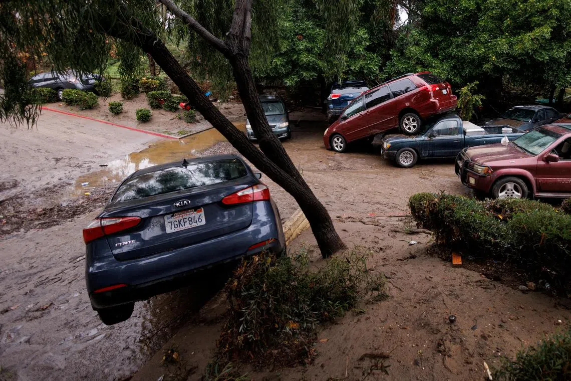 A heavy rain storm causes a small river to overflow into a neighborhood in San Diego on Jan 22.