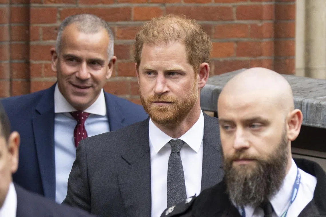 Britain's Prince Harry, Duke of Sussex (centre) leaves a court hearing in London, on March 28, 2023.