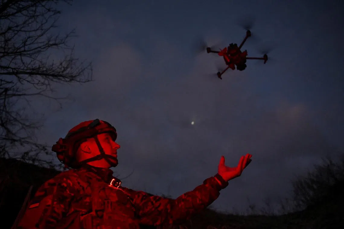 FILE PHOTO: A member of Сonsolidated Brigade 'Khyzhak' (Predator) of the Ukrainian Patrol Police Department launches a drone at a position in a front line near the town of Toretsk, amid Russia's attack on Ukraine, in Donetsk region, Ukraine December 19, 2024.  REUTERS/Stringer/File Photo