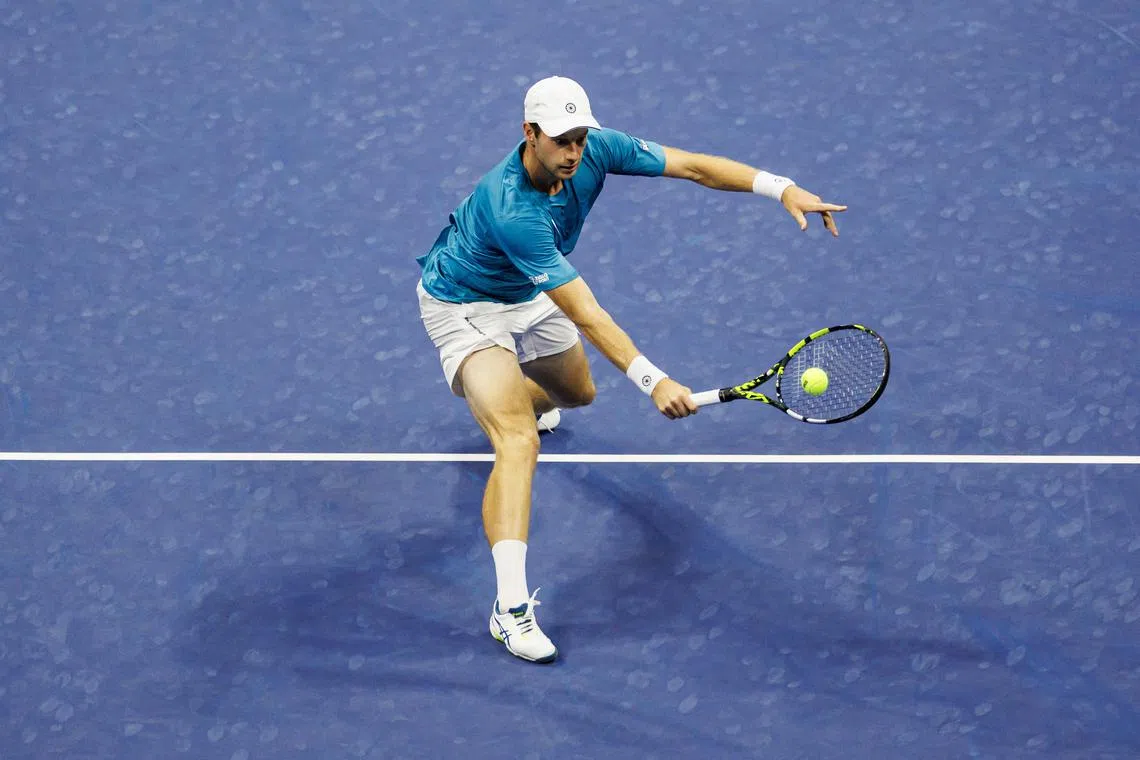 Aug 29, 2024; Flushing, NY, USA; Botic van de Zandschulp of the Netherlands in action against Carlos Alcaraz of Spain on day four of the 2024 U.S. Open tennis tournament at the USTA Billie Jean King National Tennis Center. Mandatory Credit: Mike Frey-USA TODAY Sports