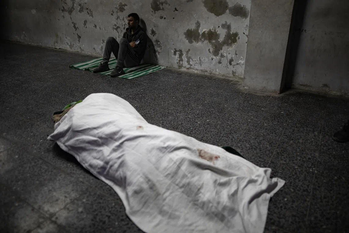 The body of Hamas spokesman Abdel Latif Al-Qanoua, at Al-Ahli Arab Hospital, in Gaza City, early on March 27.  