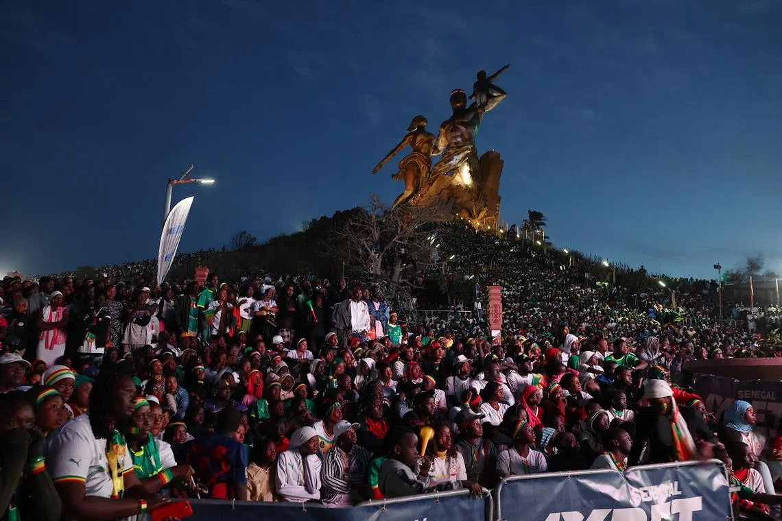 Soccer Football - CAF Africa Cup of Nations - Morocco 2025 - Final - Fans watch Senegal v Morocco - Dakar, Senegal - January 18, 2026 Senegal fans watch the final match between Senegal and Morocco near the African Renaissance Monument in Dakar REUTERS/Zohra Bensemra