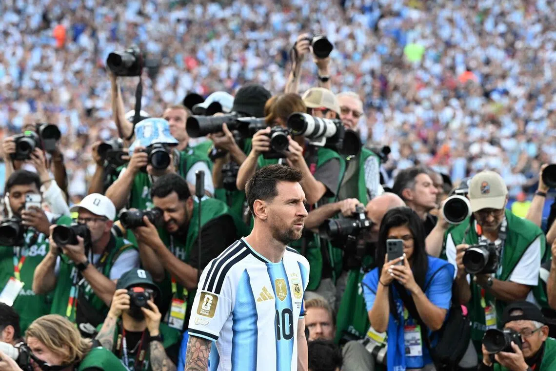 Lionel Messi entering the pitch to a throng of media attention ahead of his three-goal showing in Argentina's 3-0 2026 World Cup opening win over Algeria at Arrowhead Stadium in Kansas City on June 16.