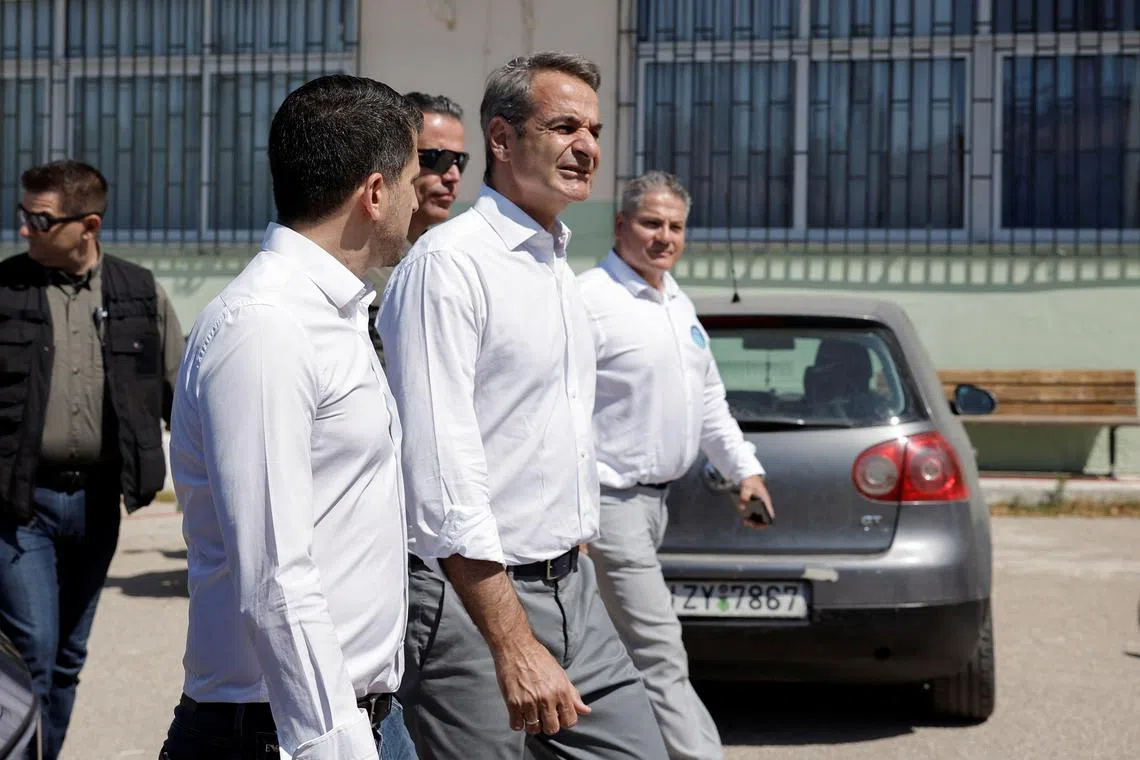 Greek Prime Minister and New Democracy conservative party leader Kyriakos Mitsotakis walks outside a polling station, during the European Union's parliamentary elections, in Athens, Greece, June 9, 2024. REUTERS/Louiza Vradi