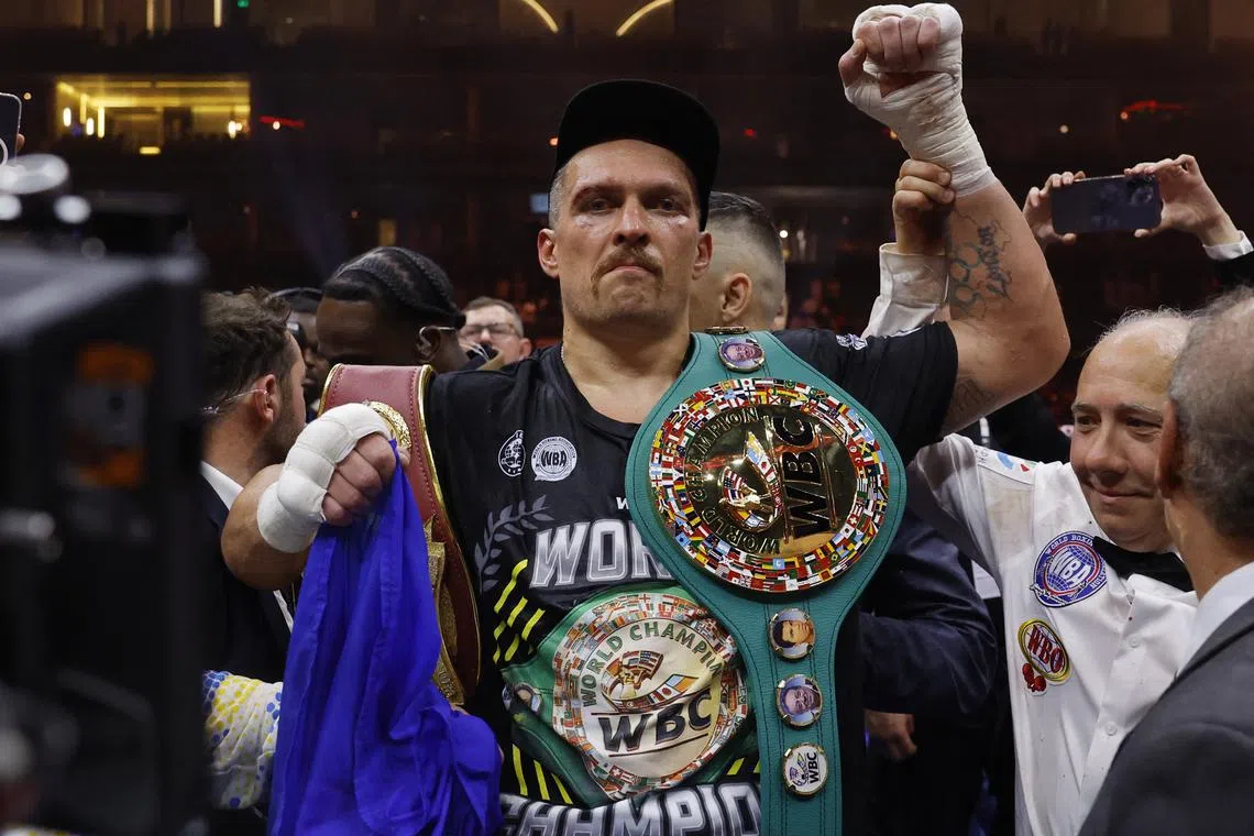 FILE PHOTO: Boxing - Tyson Fury v Oleksandr Usyk - Kingdom Arena, Riyadh, Saudi Arabia - May 19, 2024 Oleksandr Usyk celebrates with the belts after winning the fight to become the undisputed heavyweight world champion Action Images via Reuters/Andrew Couldridge/File Photo