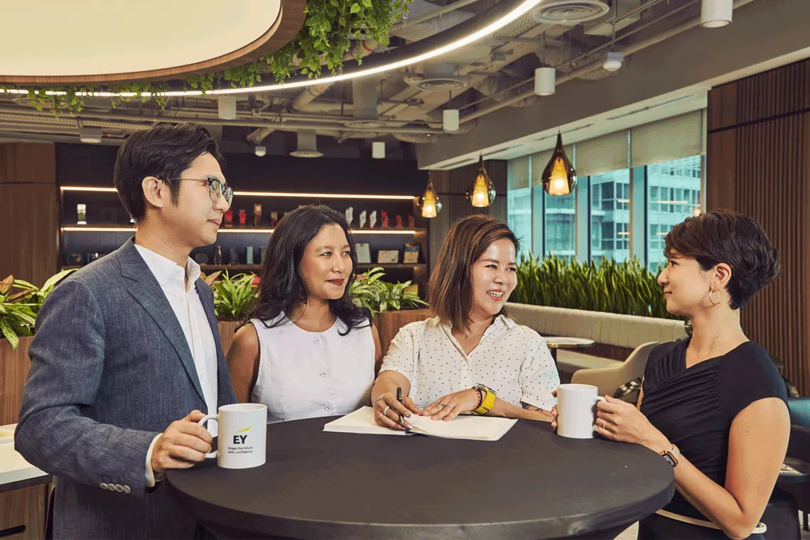 Sharon Lee at EY Singapore’s office with multicultural colleagues