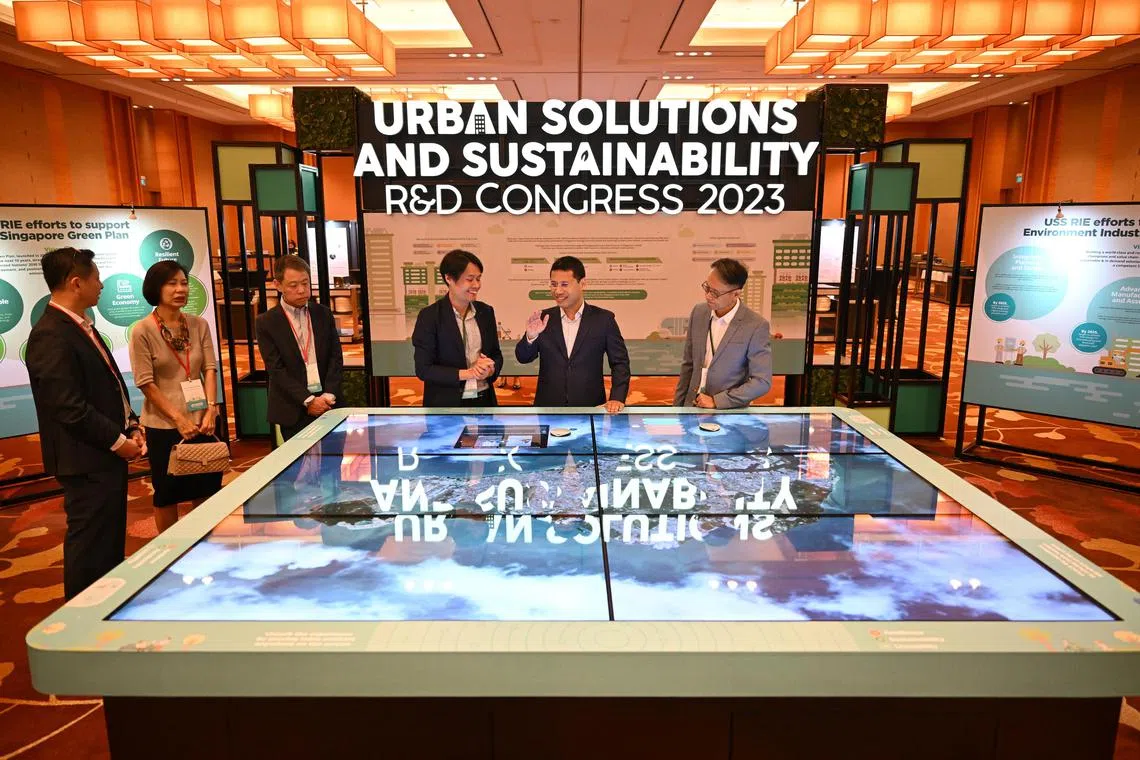 Minister for National Development Desmond Lee viewing the exhibition at the opening of the Urban Solutions & Sustainability (USS) R&D Congress 2023 held at Sands Expo and Convention Centre on Oct 4, 2023.