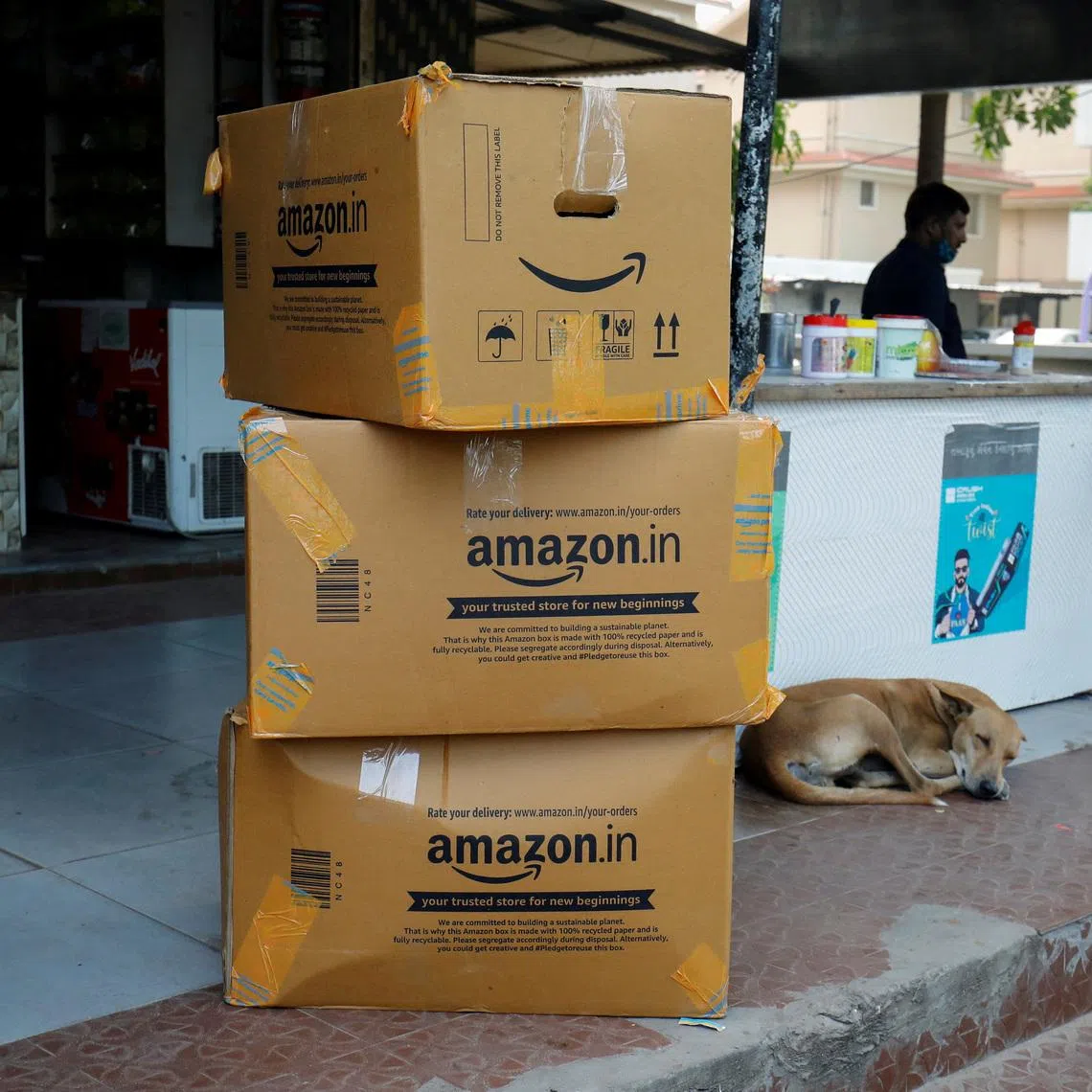 FILE PHOTO: Amazon delivery packages are seen outside a shop in Ahmedabad, India, October 5, 2021. REUTERS/Amit Dave/File Photo