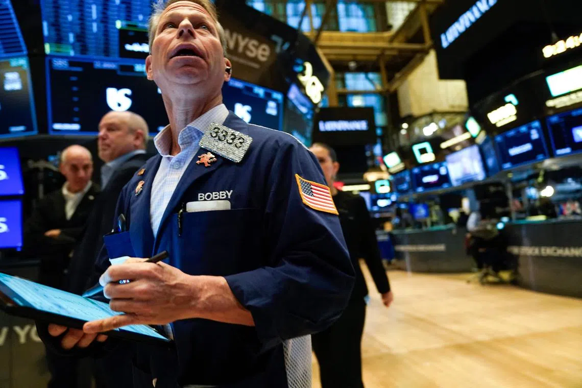 Traders working on the floor of the New York Stock Exchange, at the opening bell, on Jan 30.