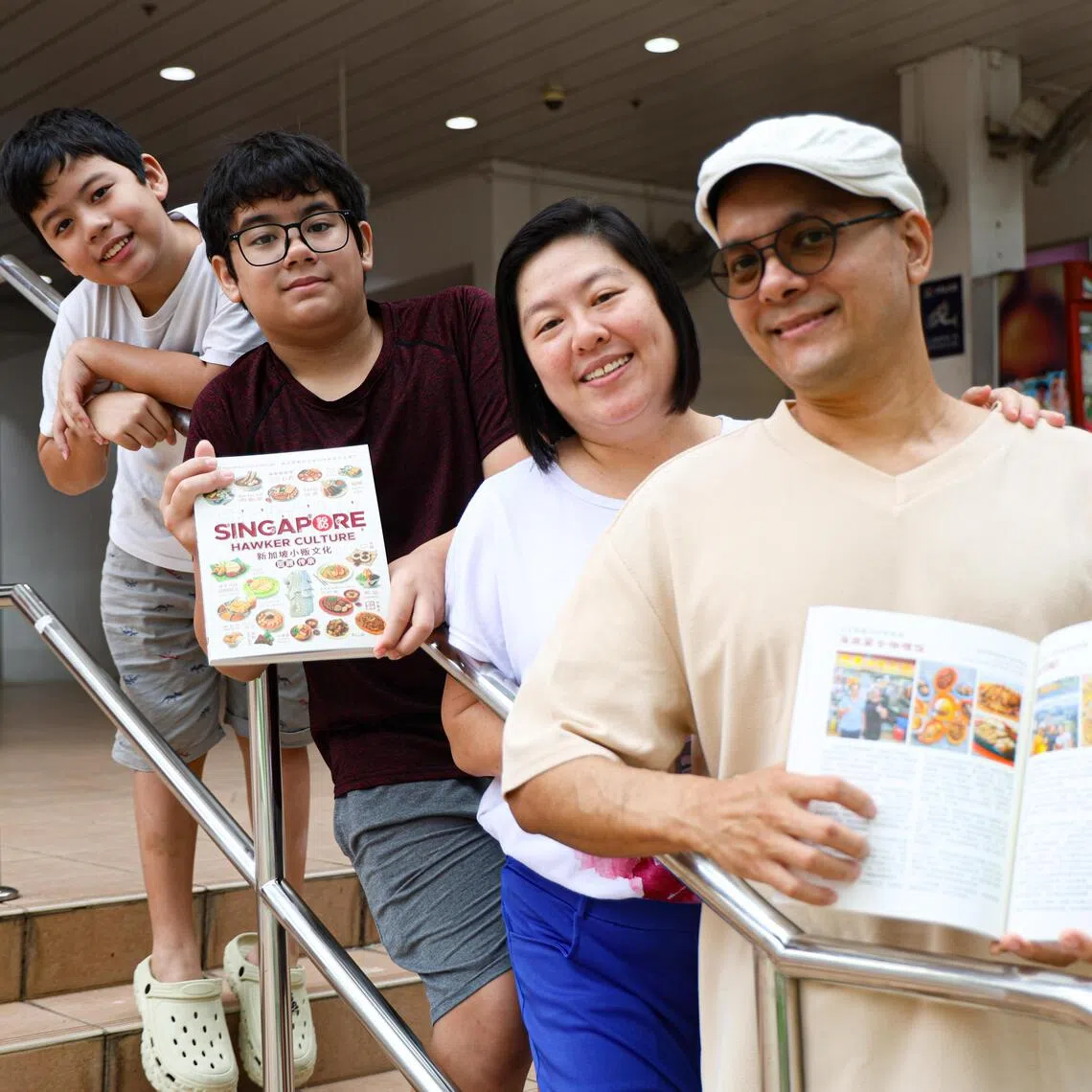 (From right) Mr Daren Oliveiro, his wife, Madam Vivian Liem, and their sons. Mr Oliveiro and Madam Liem own the Butternut hawker stall at Taman Jurong market and food centre.