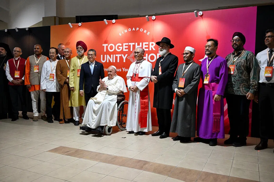 Pope Francis taking a group picture with the inter-religious figures at the Catholic Junior College, on his final day of his state visit to Singapore, on Sep 13, 2024.