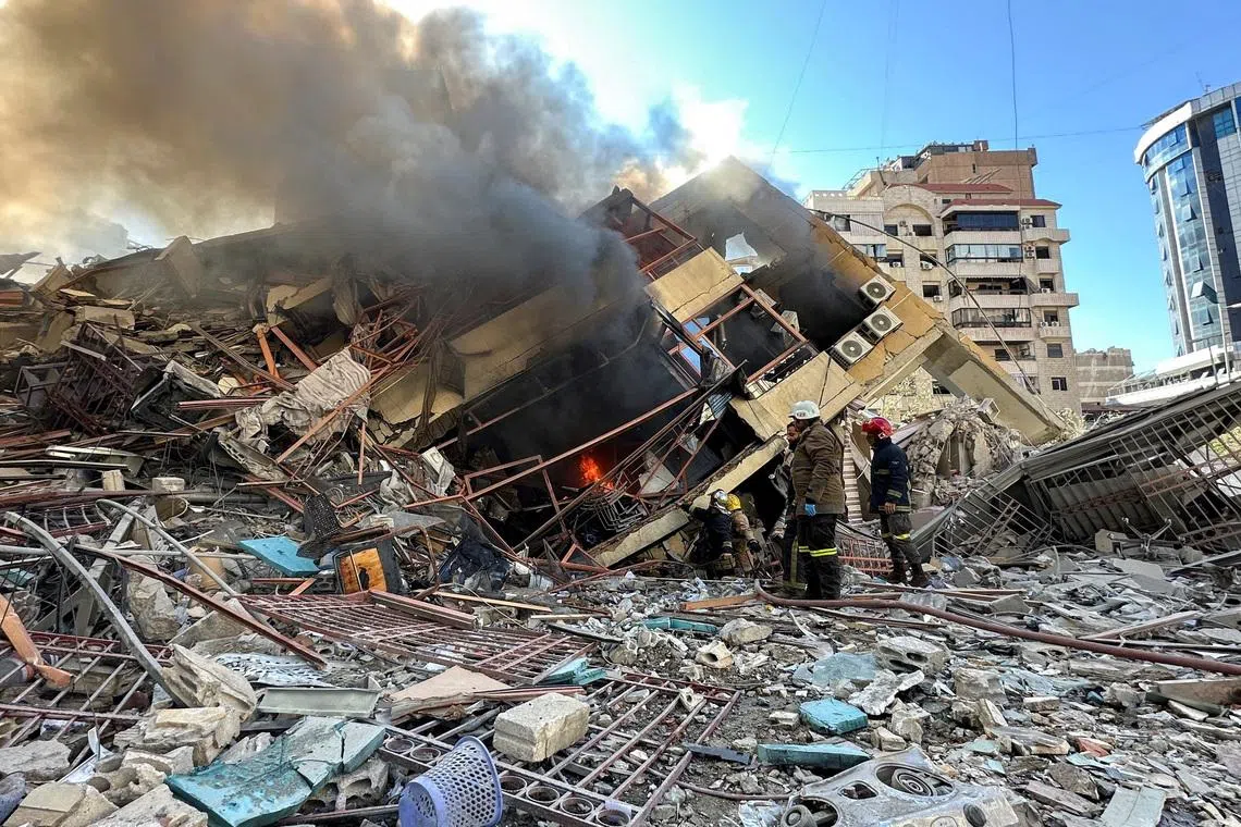 Members of the Lebanese Civil Defence inspecting a damaged building after an Israeli strike on Beirut's southern suburbs, following renewed hostilities between Hezbollah and Israel amid the US-Israeli conflict with Iran, March 9, 2026. 