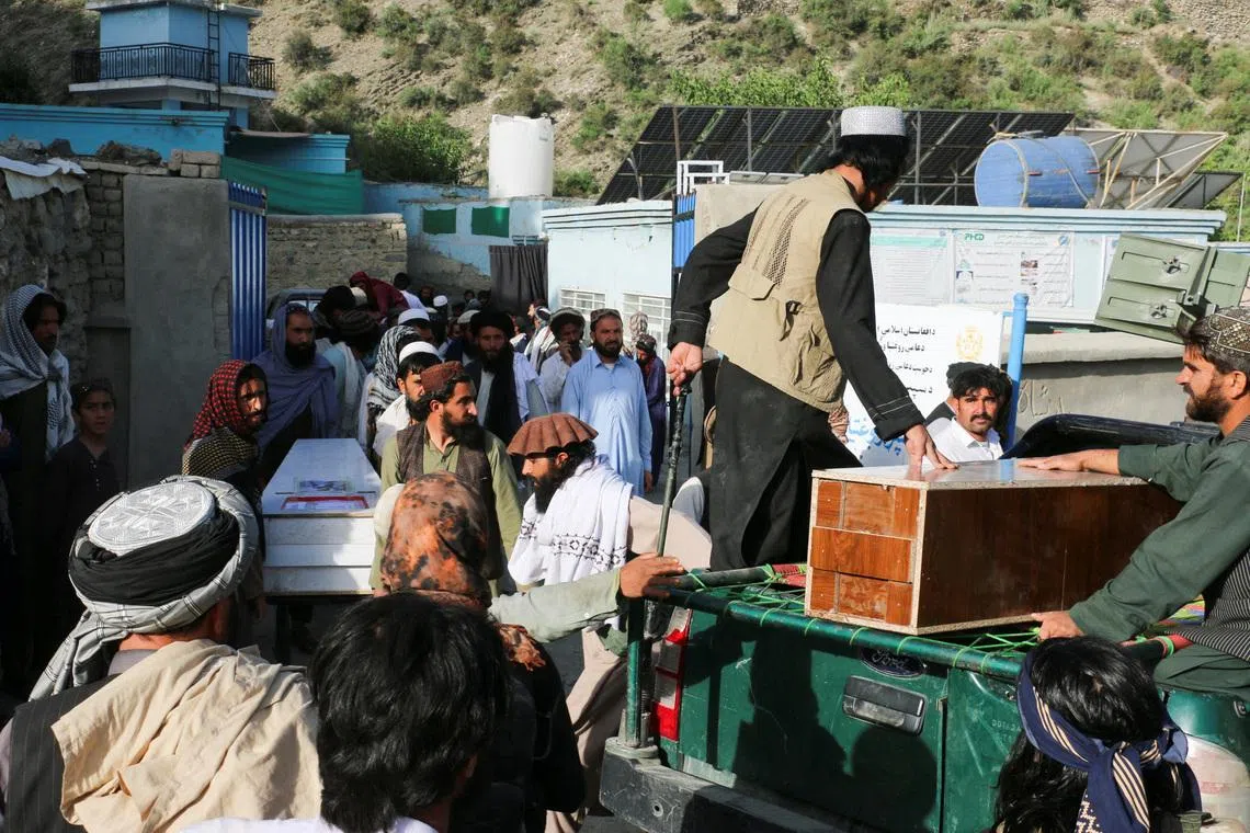 People gather near coffins containing the bodies of victims who died in what the Taliban said was a Pakistani airstrike in Mani village, Spera District, Khost Province, Afghanistan, June 10, 2026. REUTERS/Stringer