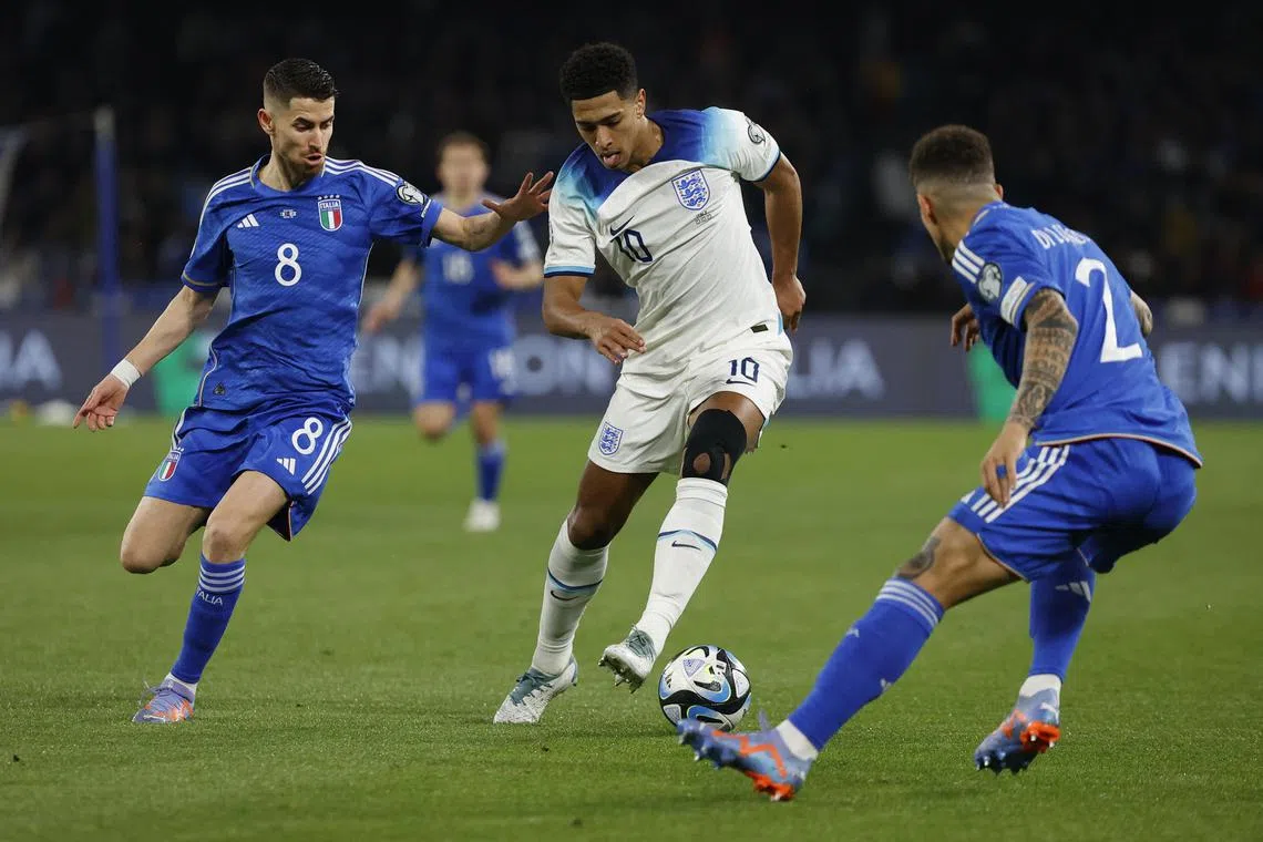 England's Jude Bellingham  battling with Italy's Jorginho and Giovanni di Lorenzo during their Euro 2024 qualifier.