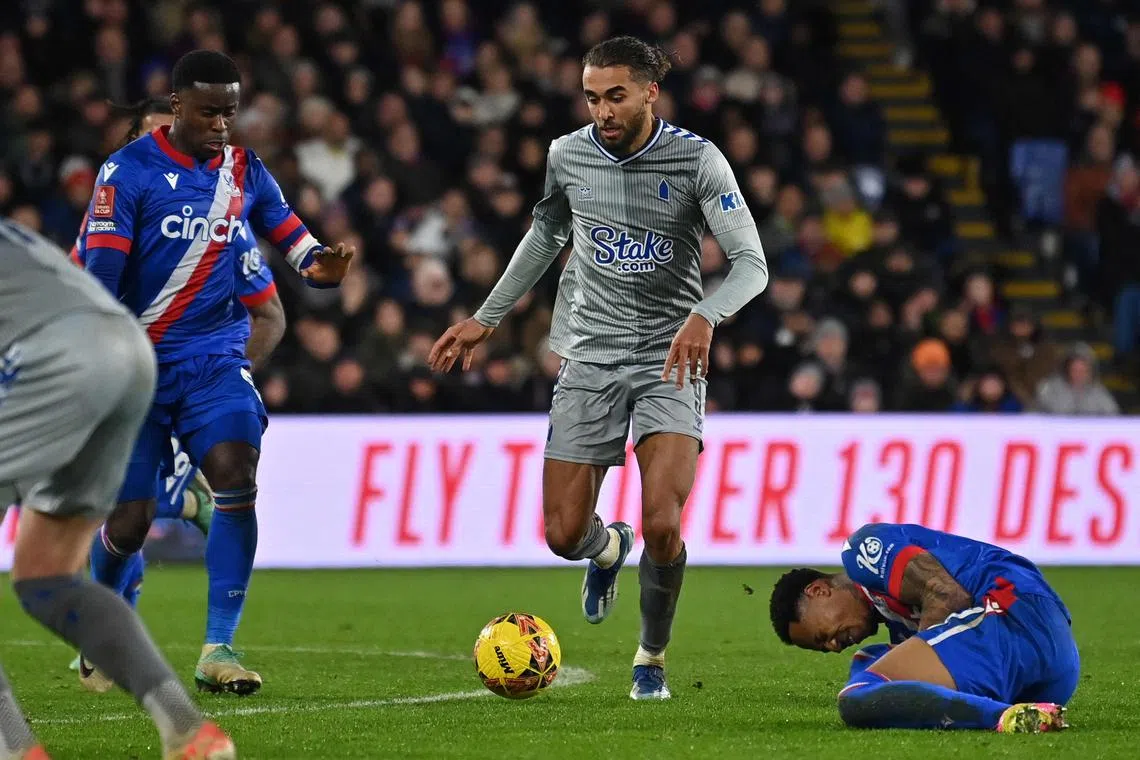 Crystal Palace's Nathaniel Clyne reacting after being fouled by Everton striker Dominic Calvert-Lewin (C) during the FA Cup third round football match.