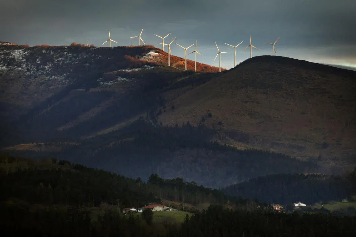Spanish utilities company Iberdrola wind turbines operating above Basque farmhouses, at Mt. Oiz, near Durango, Spain, on Mar 17, 2025. 
