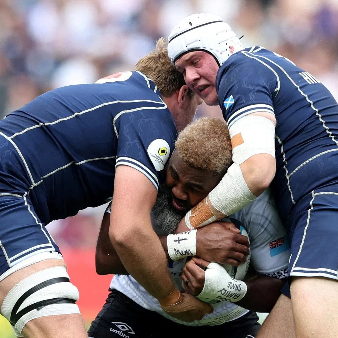 Rugby Union - Nations Championship - Fiji v Scotland - Murrayfield Stadium, Edinburgh, Scotland, Britain - July 18, 2026 Fiji's Pita Gus Sowakula in action with Scotland's Gregor Hiddleston and Jonny Gray REUTERS/Scott Heppell