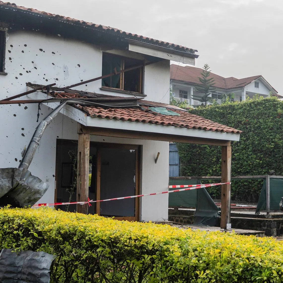 United Nations Organization Stabilization Mission in the Democratic Republic of the Congo (MONUSCO) peacekeepers assess after Congolese firefighters extinguished a fire caused by a drone strike that hit a residential neighborhood in Goma, occupied by M23 rebels, in North Kivu province, Democratic Republic of Congo, March 11, 2026. REUTERS/Stringer