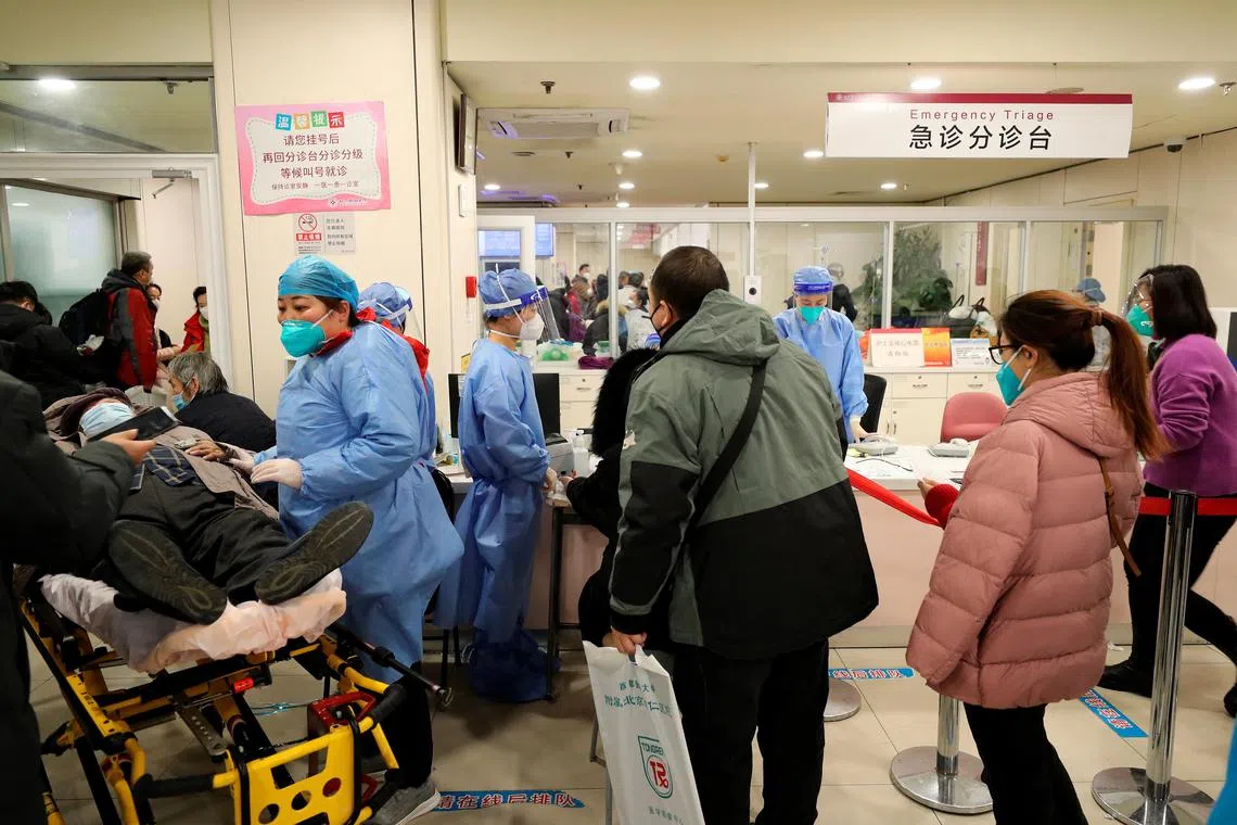 Patients line up for treatment at the emergency department of Beijing Chaoyang hospital, amid the coronavirus disease (COVID-19) outbreak in Beijing, China December 27, 2022. China Daily via REUTERS  ATTENTION EDITORS - THIS IMAGE WAS PROVIDED BY A THIRD PARTY. CHINA OUT. 
